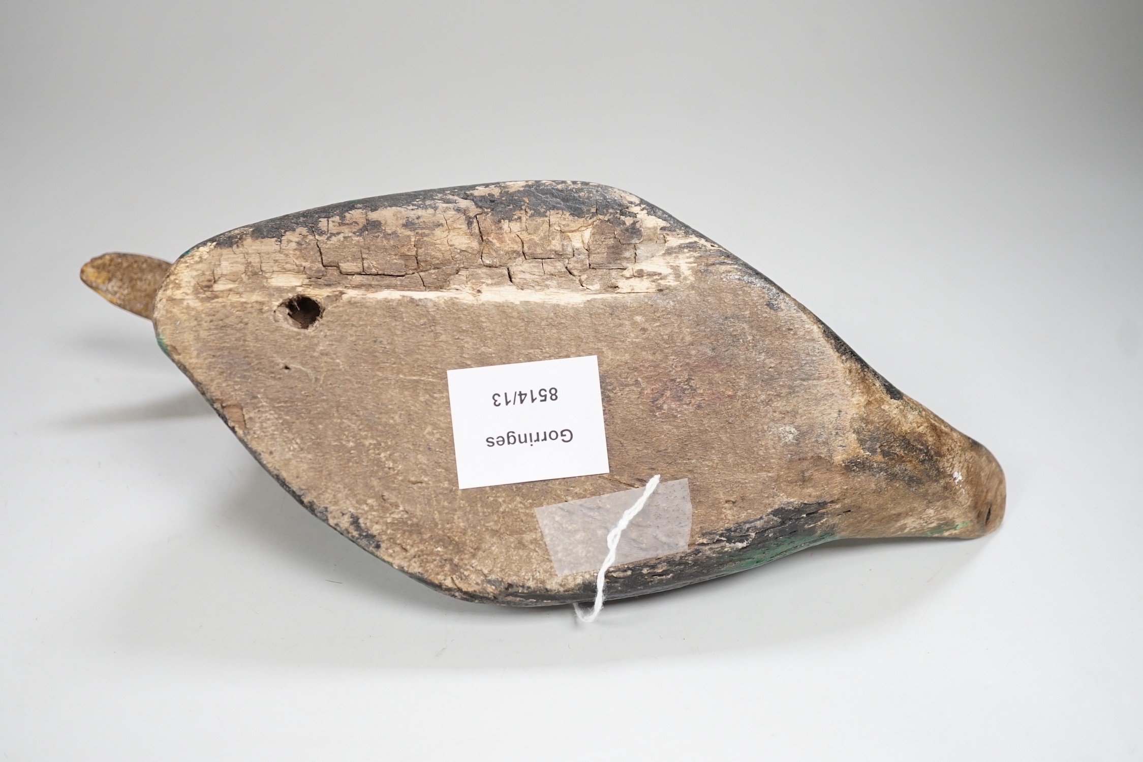 A 19th century painted decoy duck. 31cm long
